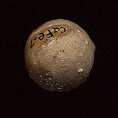 Colour photograph of a lead bullet and its Borden Code.